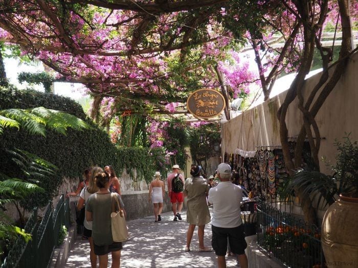 Positano beachfront promenade leading toward Piazza dei Mulini