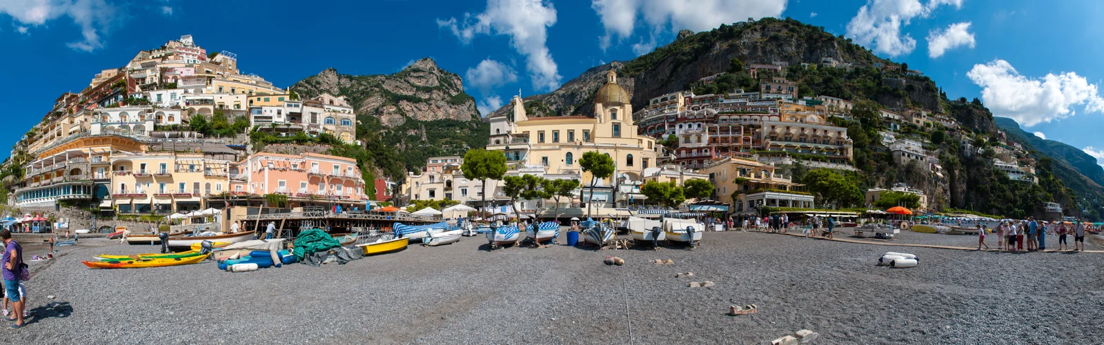 Wide panorama of Positano's hillside houses above Spiaggia Grande beach