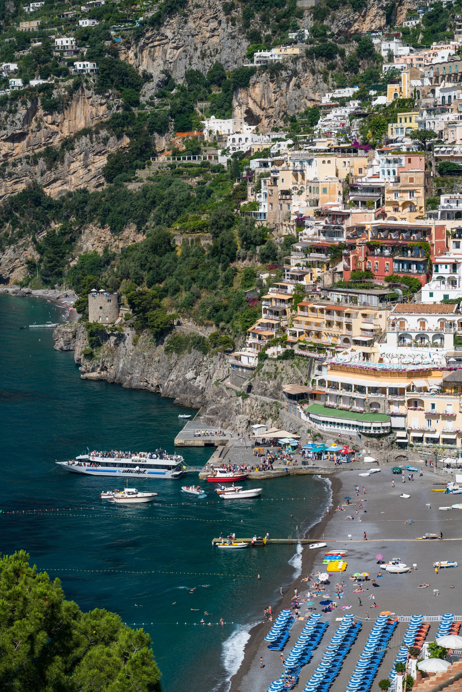 Spiaggia Grande in Positano with colourful umbrellas and boats in the bay