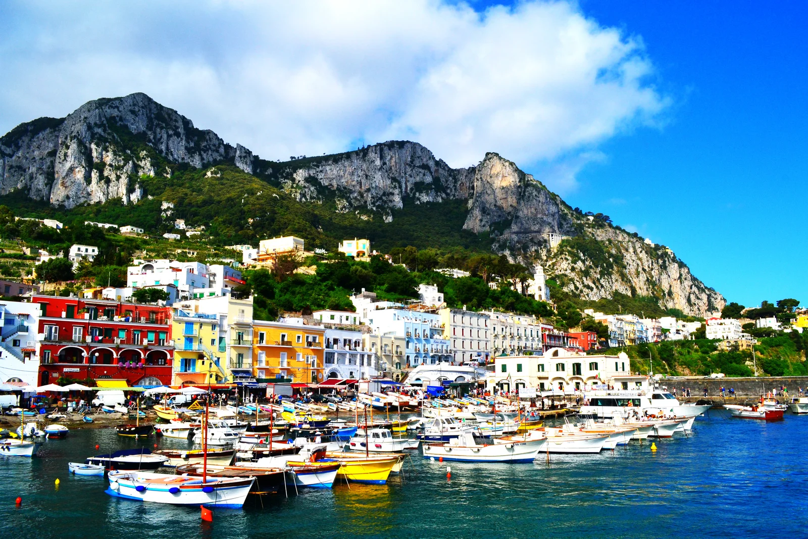 Marina Grande ferry port in Capri with boats and ticket booths