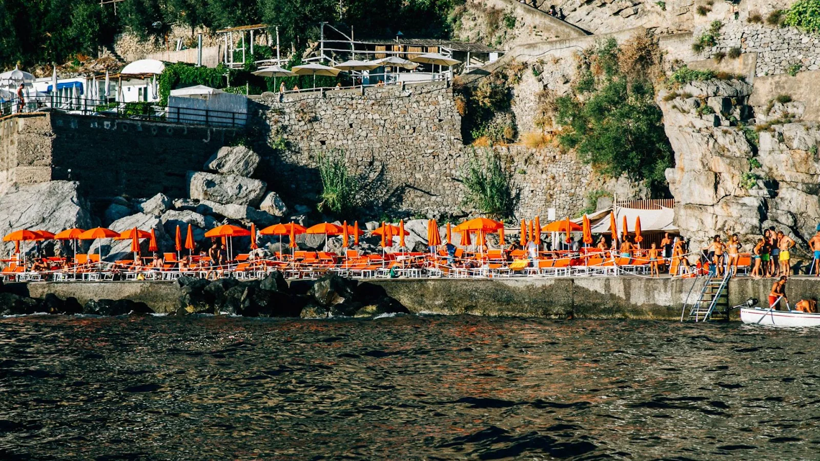 One Fire Beach Club with bright loungers, DJ podium, and party atmosphere