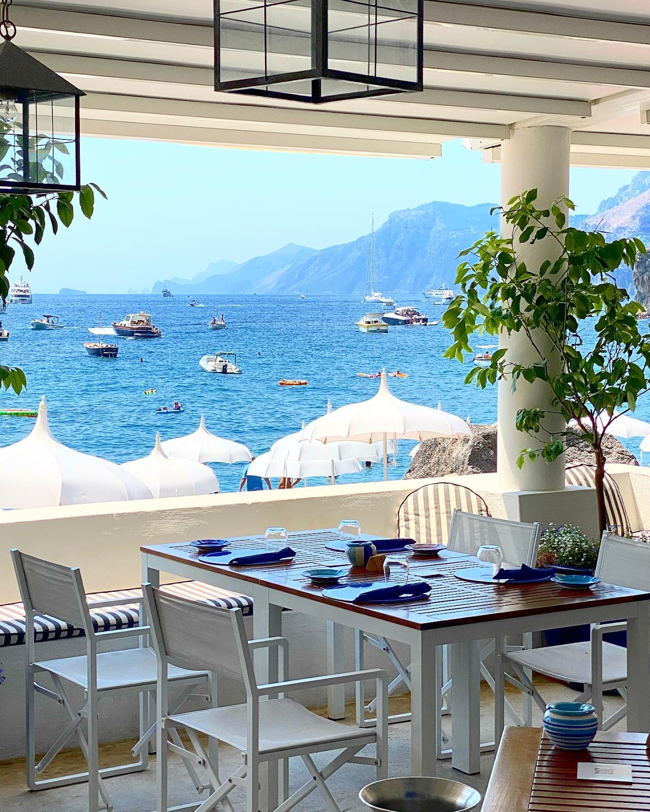 Villa Tre Ville beach club with terracotta loungers and premium service