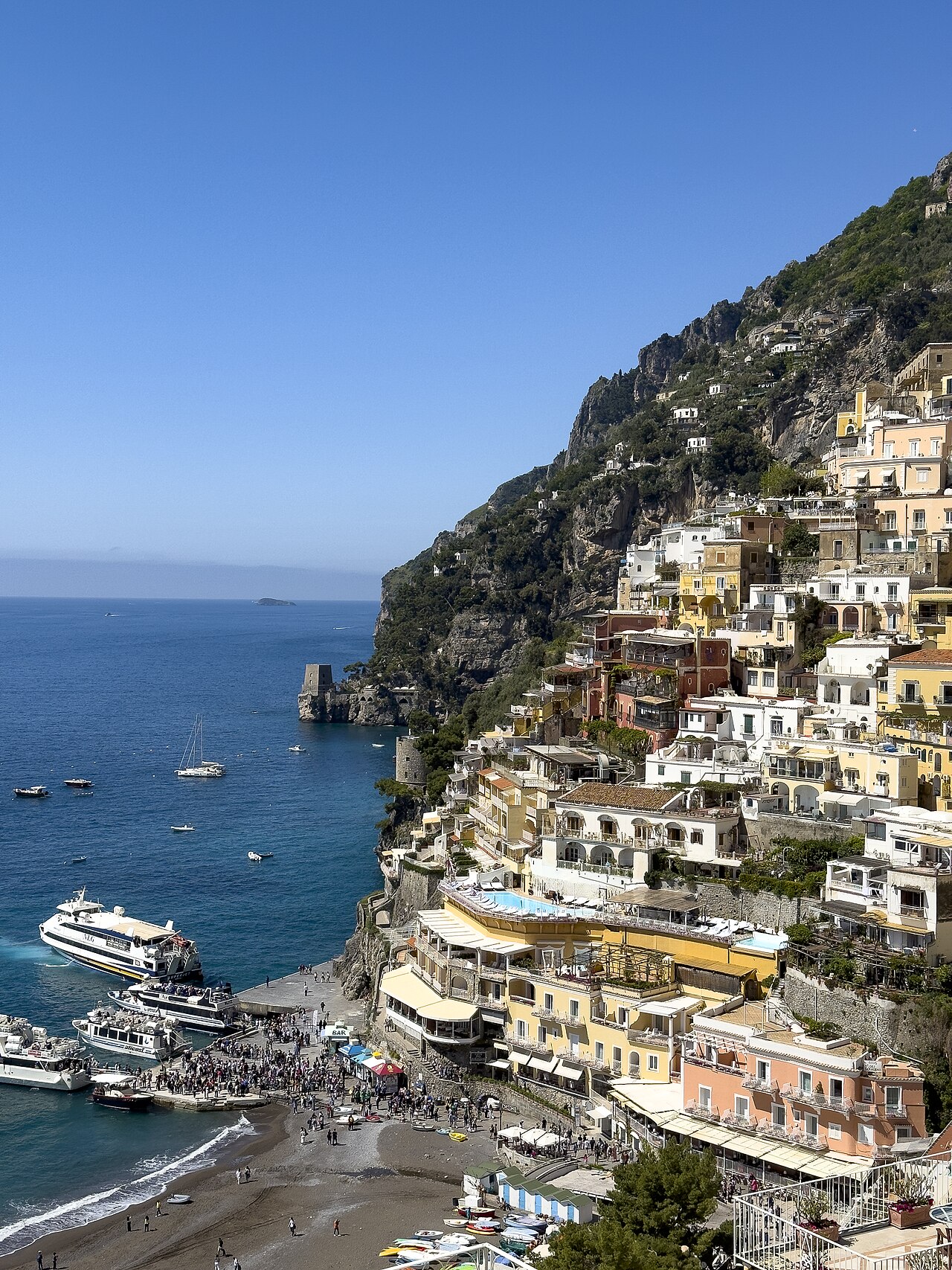 View over Positano and the sea with boats near the shore