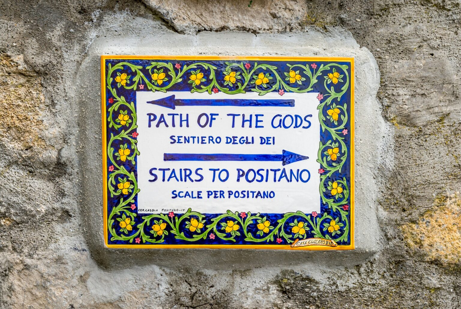 Directional signpost warning about the stairs down to Positano