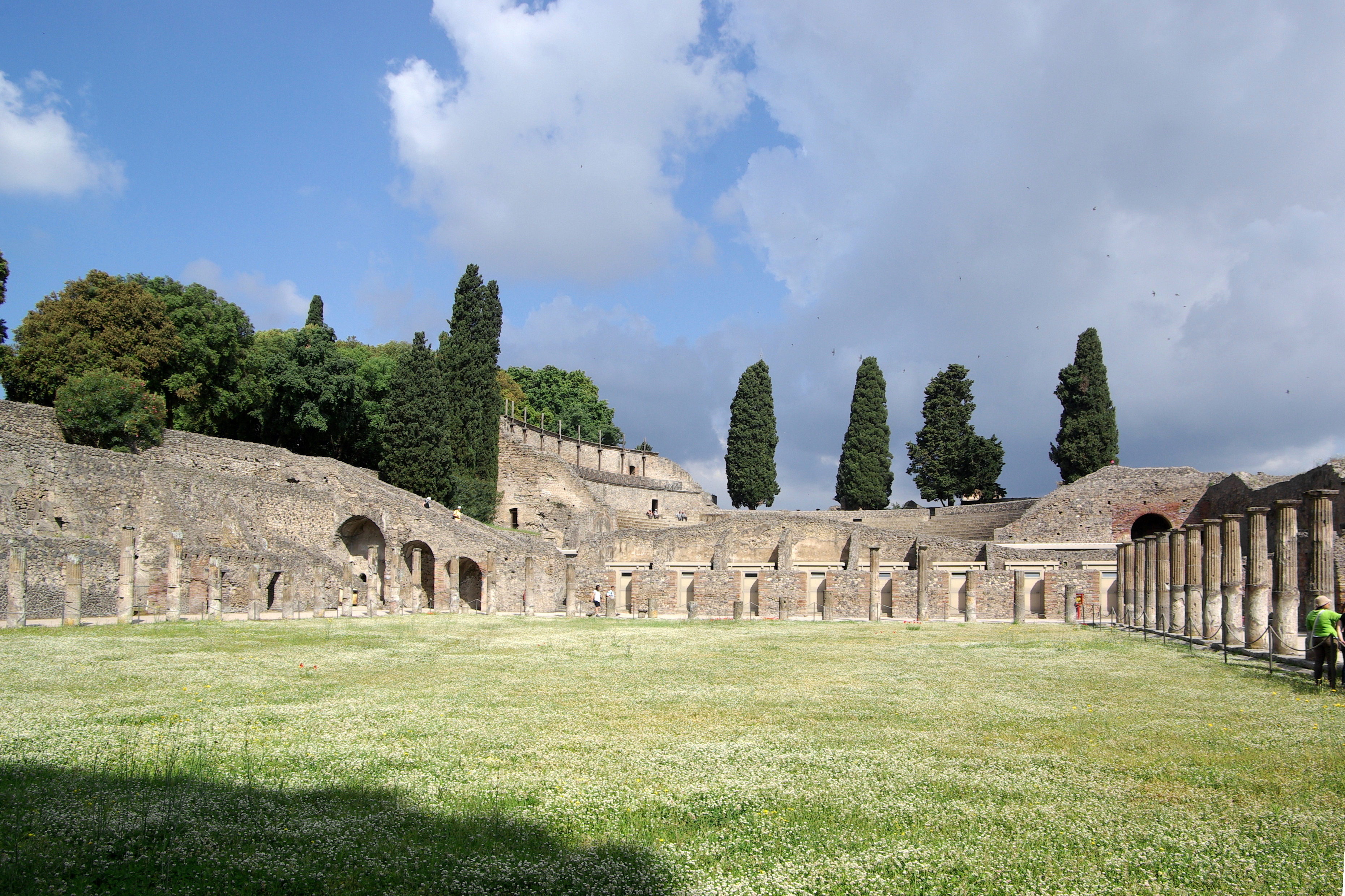Ancient amphitheater at Pompeii with Mount Vesuvius backdrop
