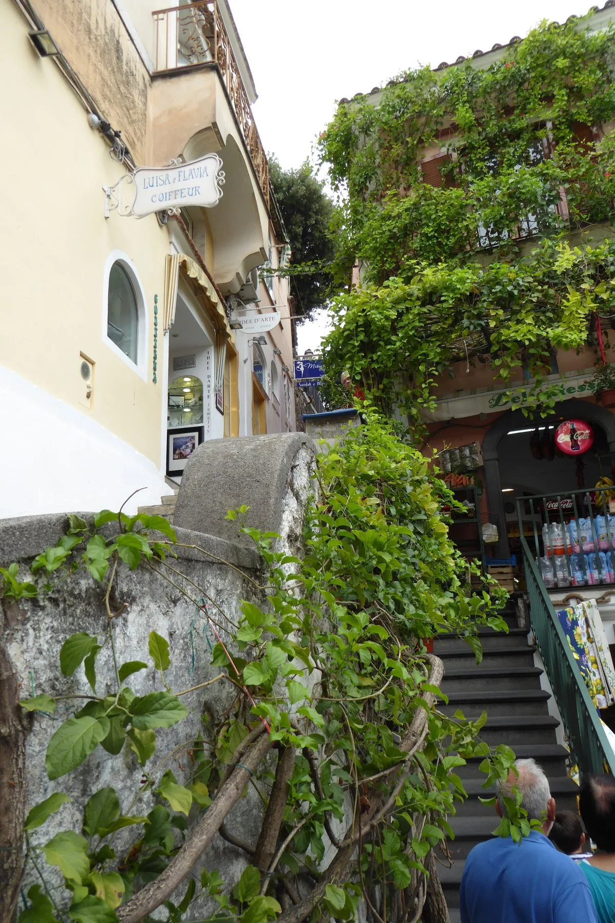 Narrow stone staircase between shops in Positano village