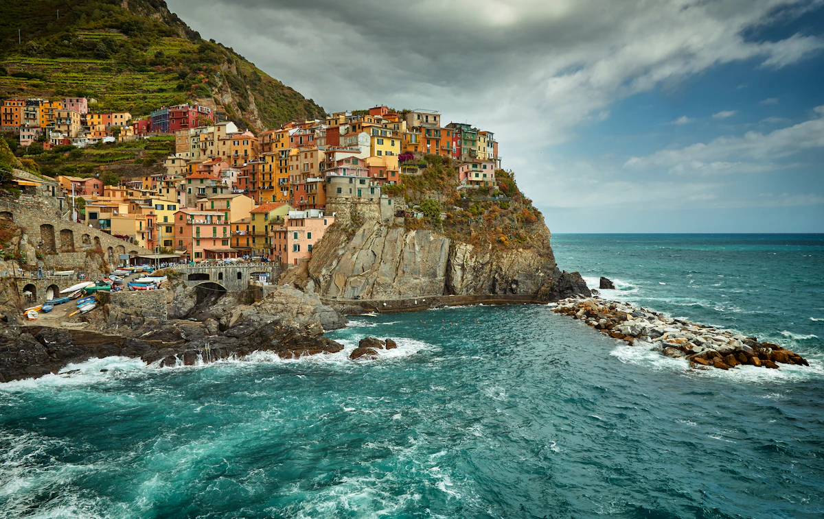 Hiking trail along the Cinque Terre coast with colourful villages below