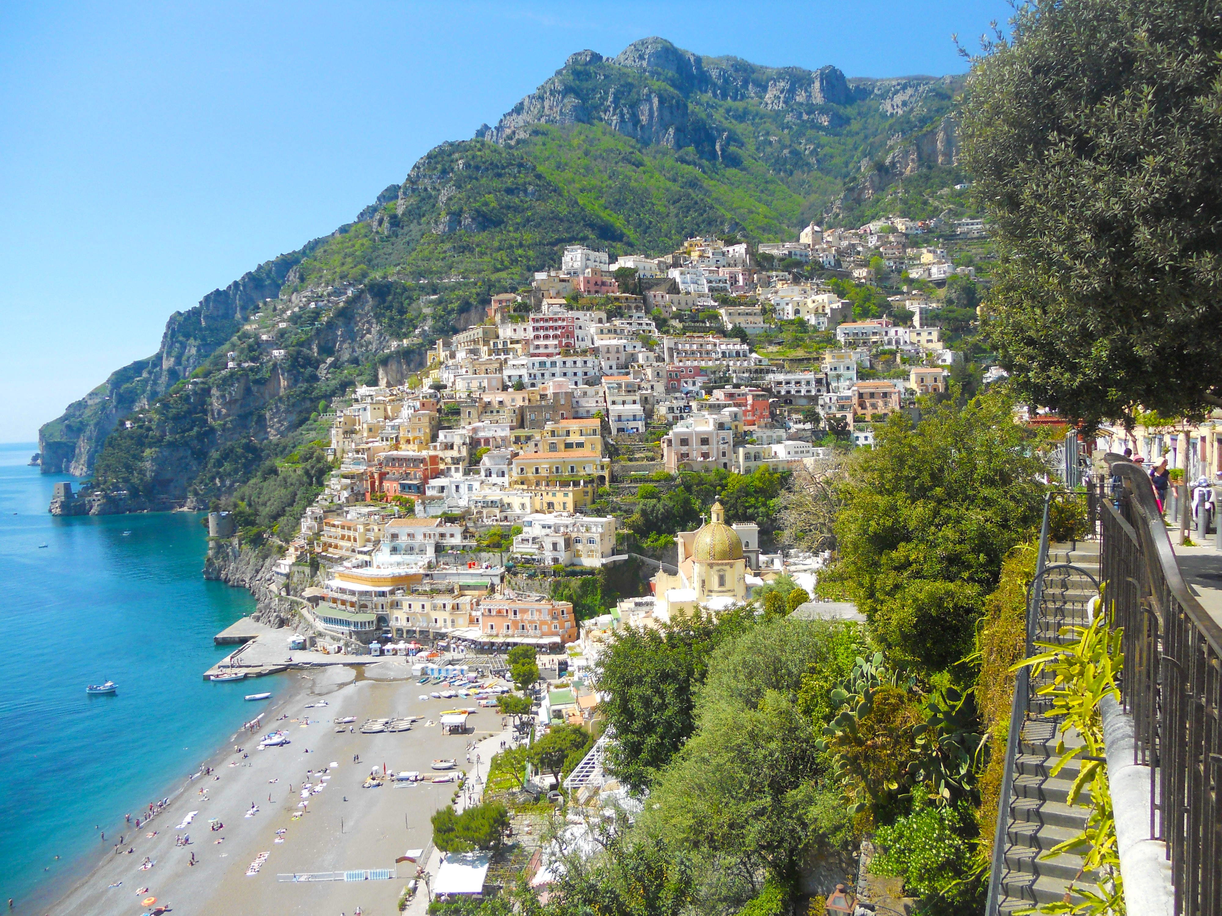 Positano ferry dock with boats departing for day trips.